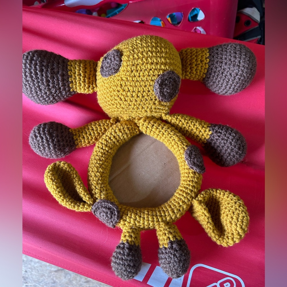 Handmade crocheted weird animal picture frame‎ ?